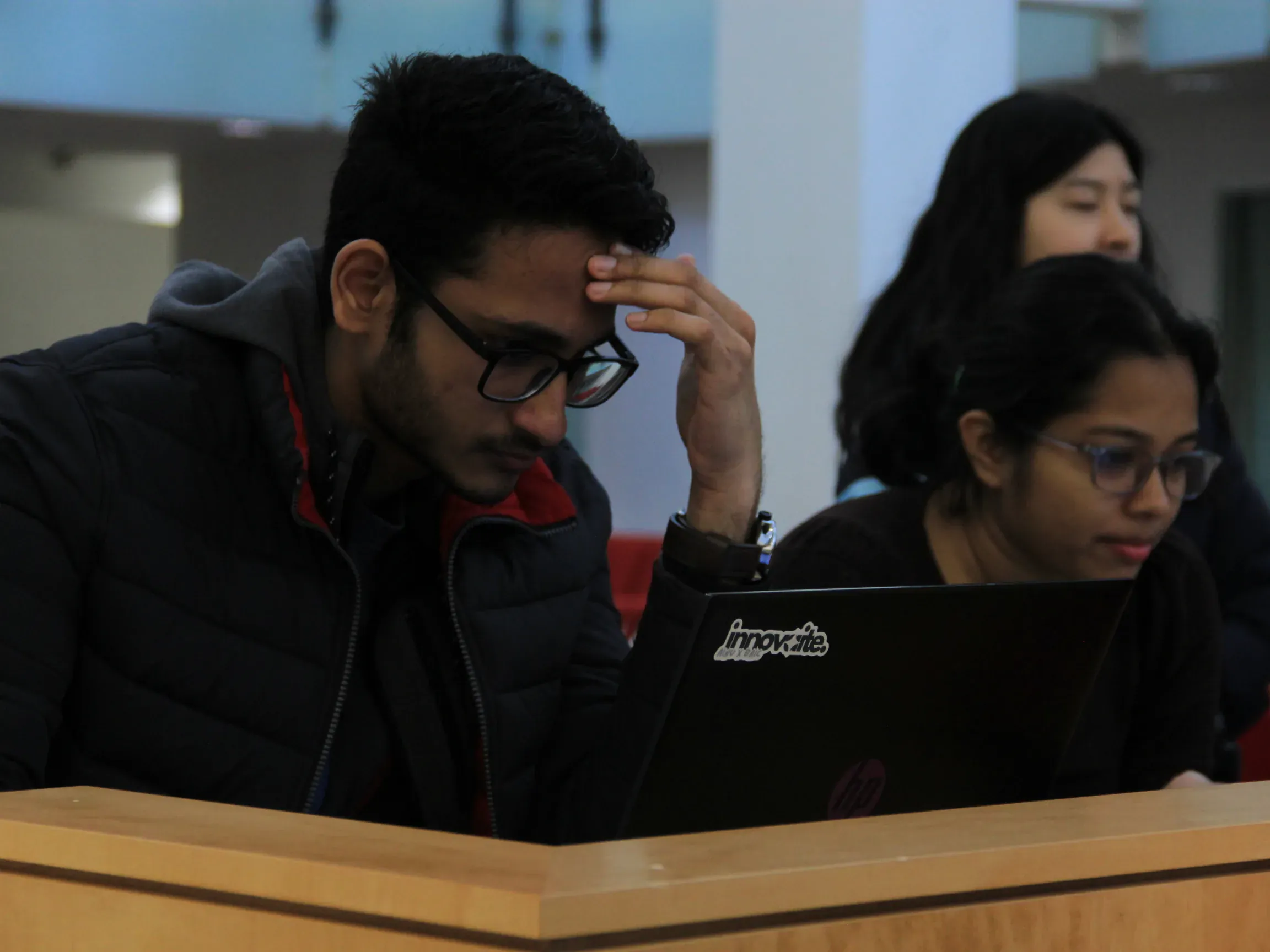 AINU builders working through an AI project together