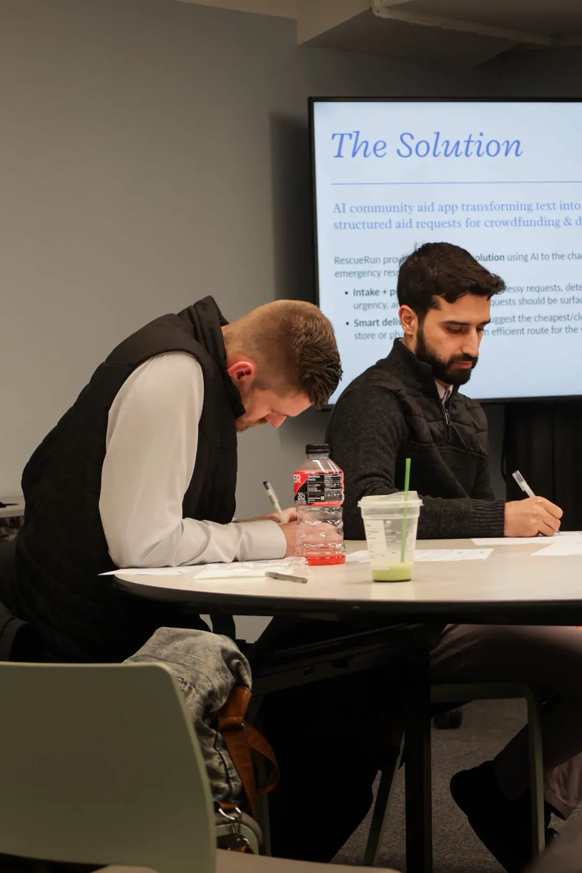 Judges reviewing AINU project submissions